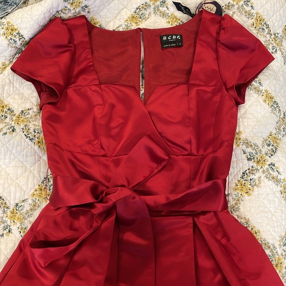 This is a gorgeous satin red dress. It’s a size 4. - Picture 3 of 4